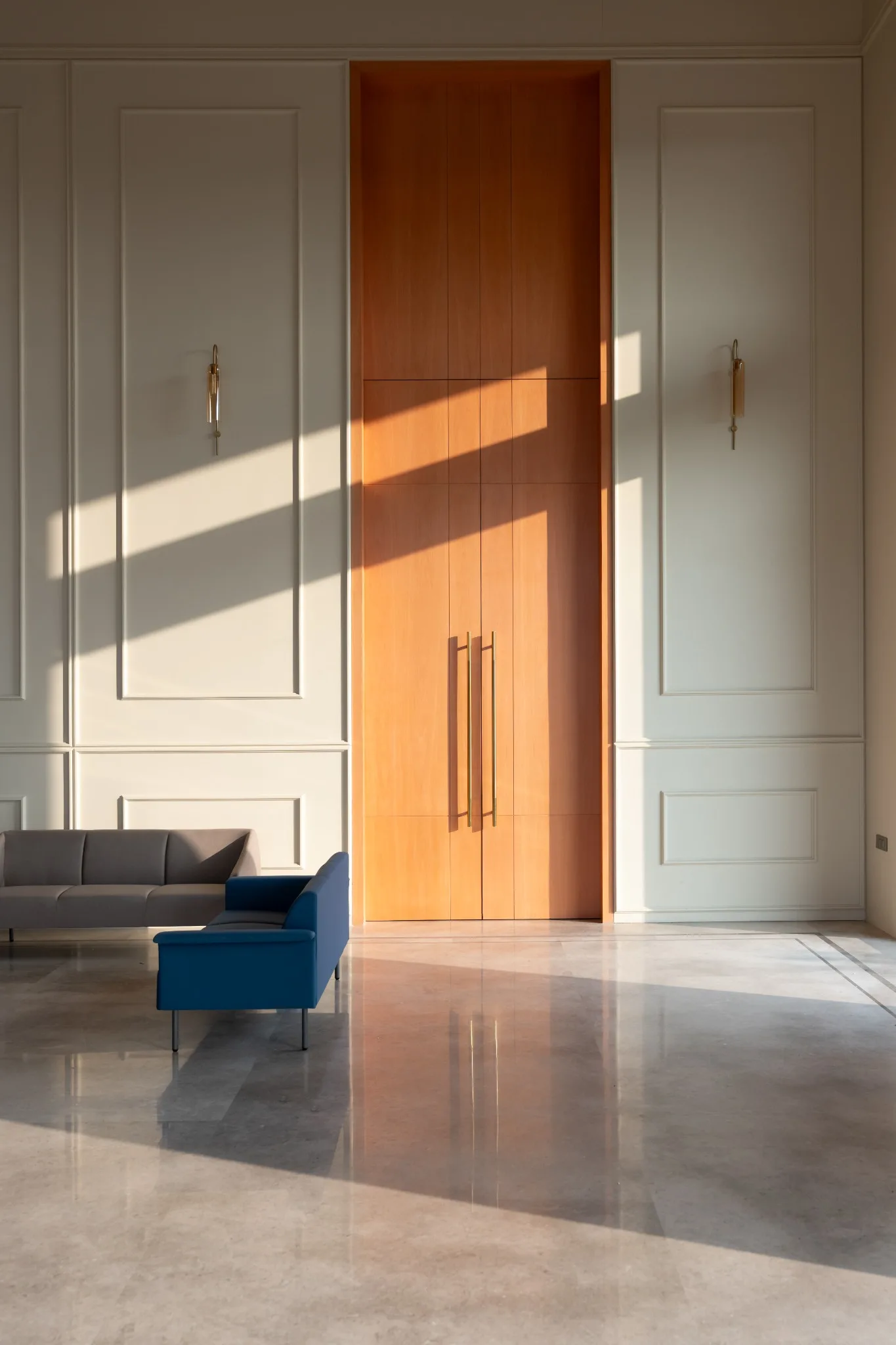 MOMENTUS entrance detail with warm lighting